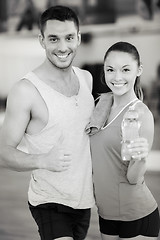 Image showing two smiling people in the gym