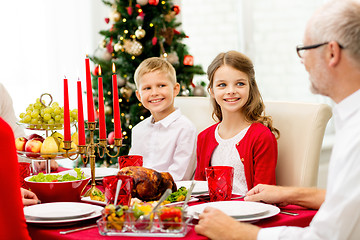 Image showing smiling family having holiday dinner at home