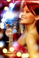 Image showing woman with cocktail and disco ball