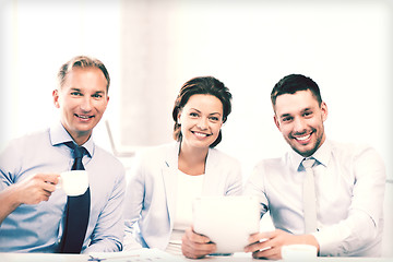 Image showing business team having fun with tablet pc in office