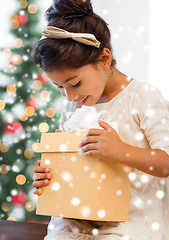 Image showing smiling little girl with gift box