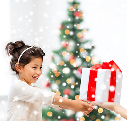 Image showing smiling little girl with gift box