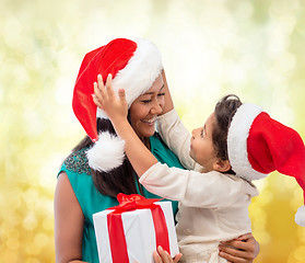 Image showing happy mother and child girl with gift box