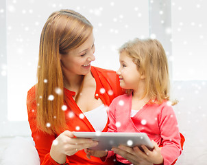 Image showing happy mother and daughter with tablet pc computer