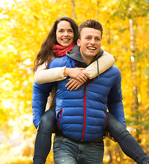 Image showing smiling couple having fun in autumn park