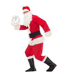 Image showing man in costume of santa claus with clock