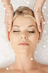 Image showing beautiful woman getting face or head massage