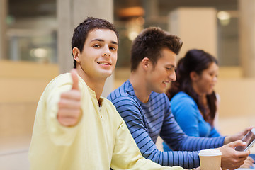 Image showing group of students with tablet pc and coffee cup