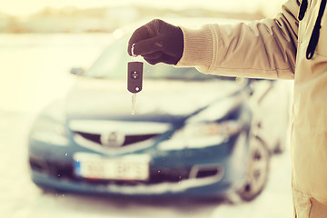 Image showing closeup of man hand with car key outdoors