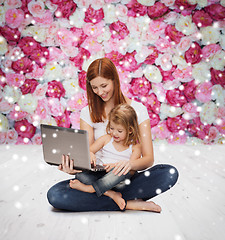 Image showing happy mother with little girl and laptop