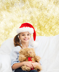 Image showing smiling little girl with teddy bear