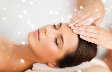 Image showing beautiful woman getting face or head massage