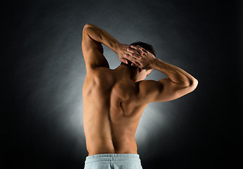 Image showing young male bodybuilder from back