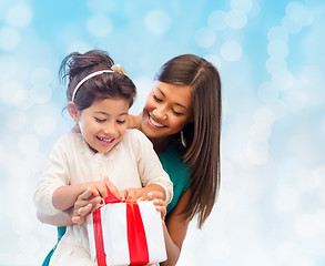 Image showing happy mother and little girl with gift box