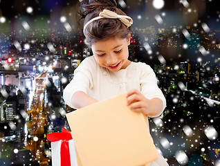 Image showing smiling little girl with gift box