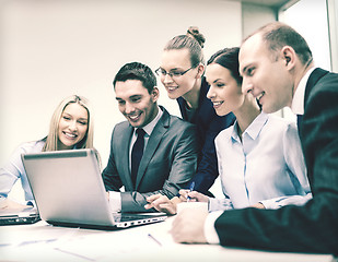 Image showing business team with laptop having discussion