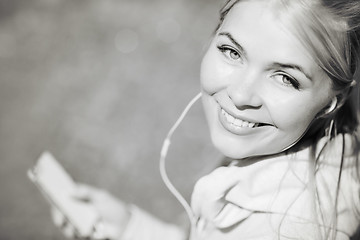 Image showing woman listening to music outdoors