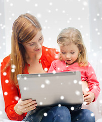 Image showing happy mother and daughter with laptop computer