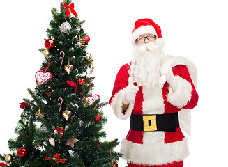 Image showing santa claus with bag and christmas tree