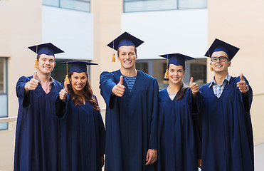 Image showing group of smiling students in mortarboards