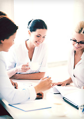 Image showing businesswoman with team on meeting in office