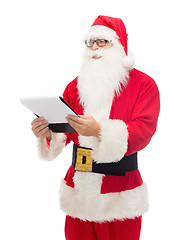 Image showing man in costume of santa claus with notepad