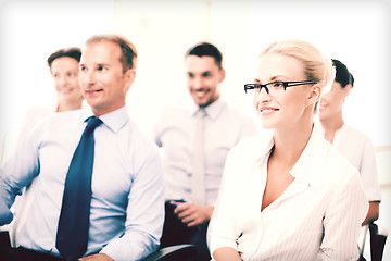 Image showing businessmen and businesswomen on conference