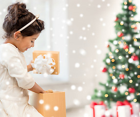 Image showing smiling little girl with gift box