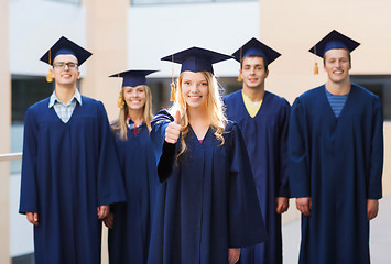 Image showing group of smiling students in mortarboards