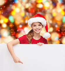 Image showing girl in santa helper hat with blank white board