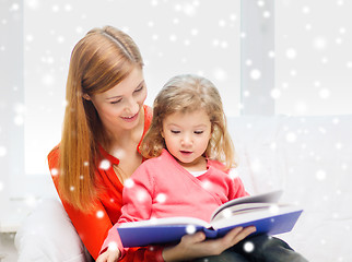 Image showing mother and daughter with book