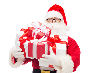 Image showing man in costume of santa claus with gift boxes