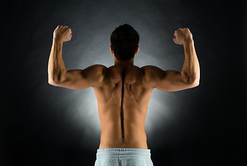 Image showing young male bodybuilder from back