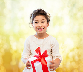 Image showing smiling little girl with gift box