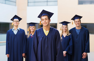 Image showing group of smiling students in mortarboards