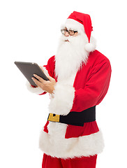 Image showing man in costume of santa claus with tablet pc