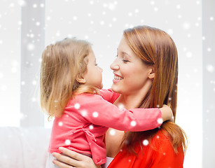 Image showing happy mother and daughter kissing