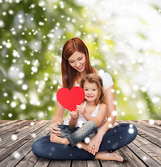 Image showing happy mother with adorable little girl and heart