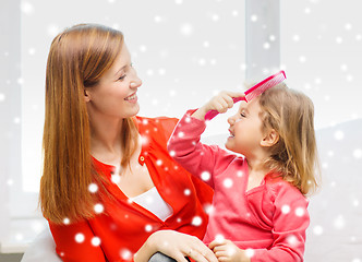 Image showing mother and daughter with comb