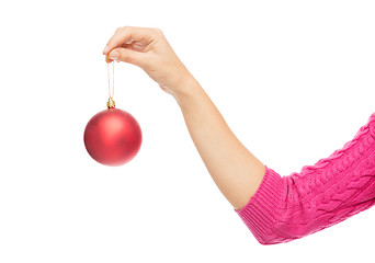 Image showing close up of woman in sweater with christmas ball