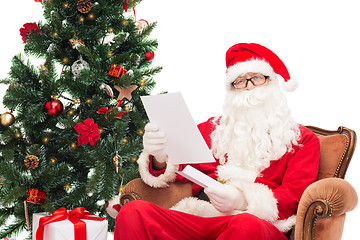 Image showing man in costume of santa claus with letter