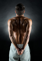 Image showing young male bodybuilder from back