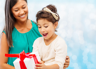 Image showing happy mother and little girl with gift box