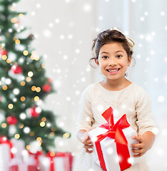 Image showing smiling little girl with gift box