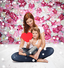 Image showing happy mother with adorable little girl and heart