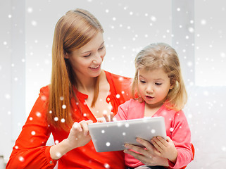 Image showing happy mother and daughter with tablet pc computer