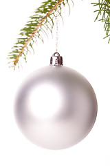 Image showing Christmas ball hanging from a branch of a fir tree