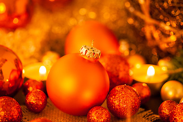 Image showing Warm gold and red Christmas candlelight background