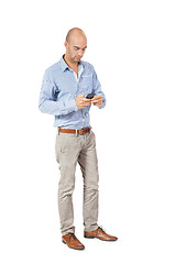 Image showing Handsome man reading a message on his mobile