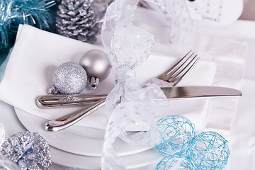 Image showing Stylish blue and silver Christmas table setting